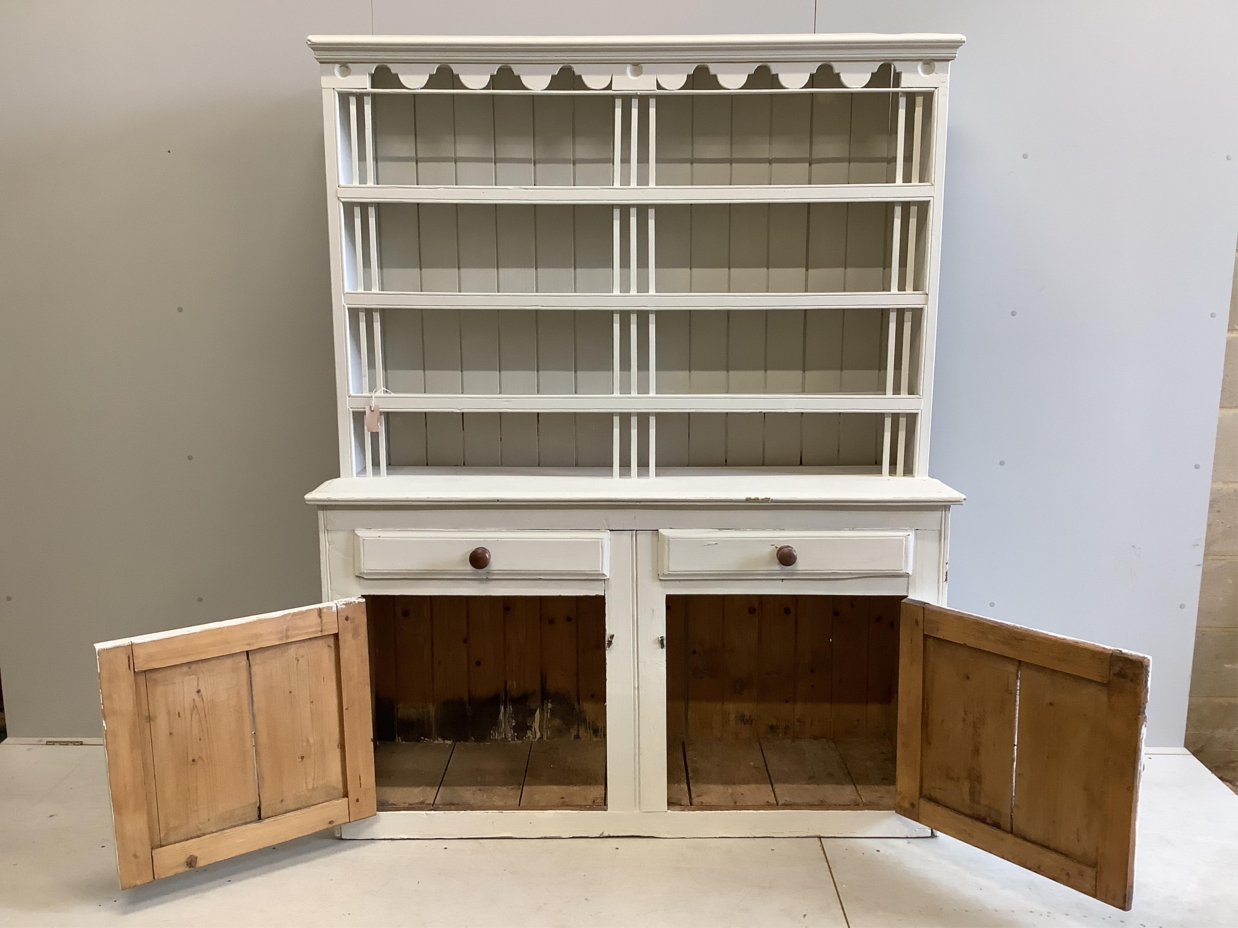 A 19th century Irish pine dresser with boarded rack, later painted, width 162cm, depth 49cm, height 201cm. Condition - fair